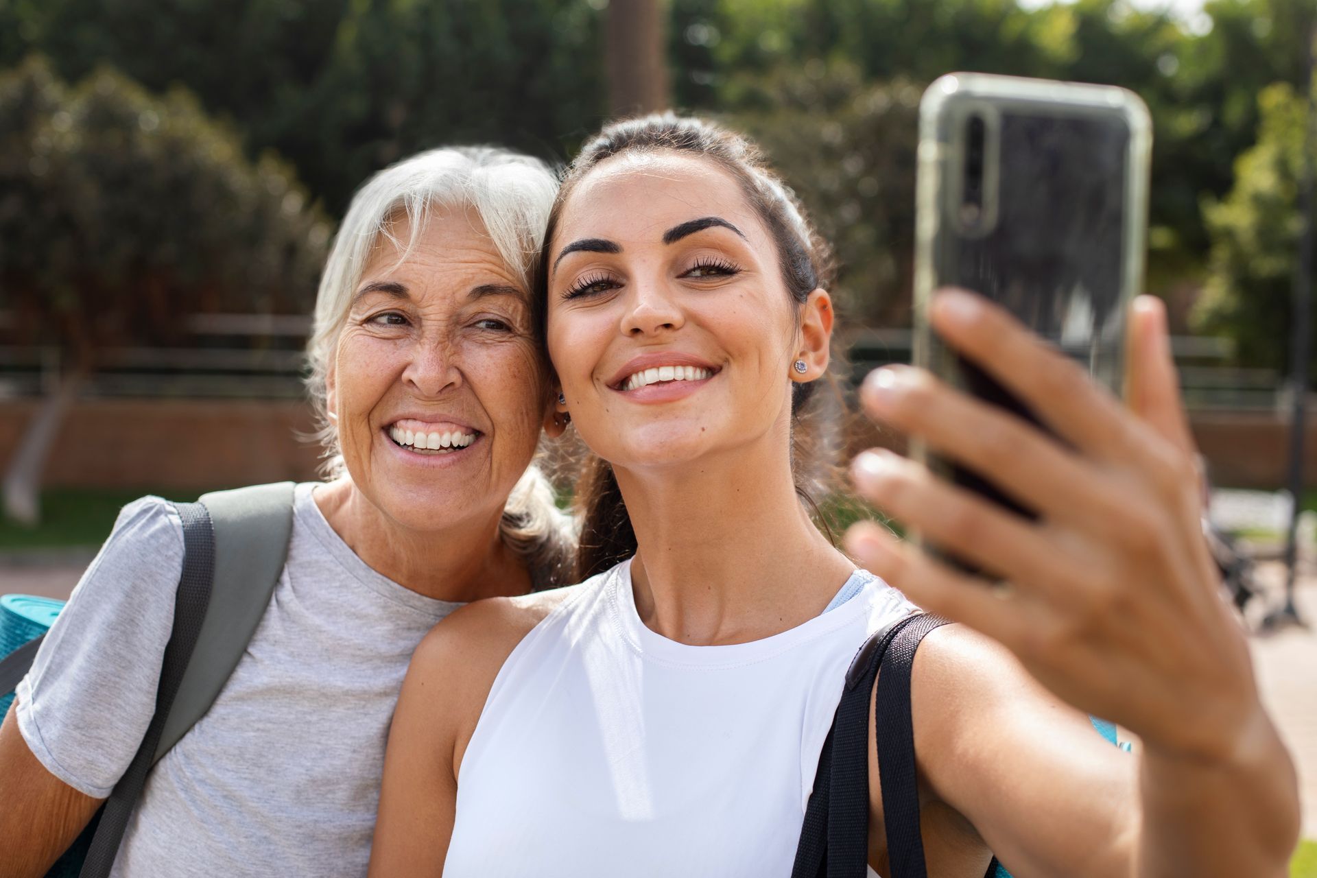 A woman is taking a selfie with her mother.
