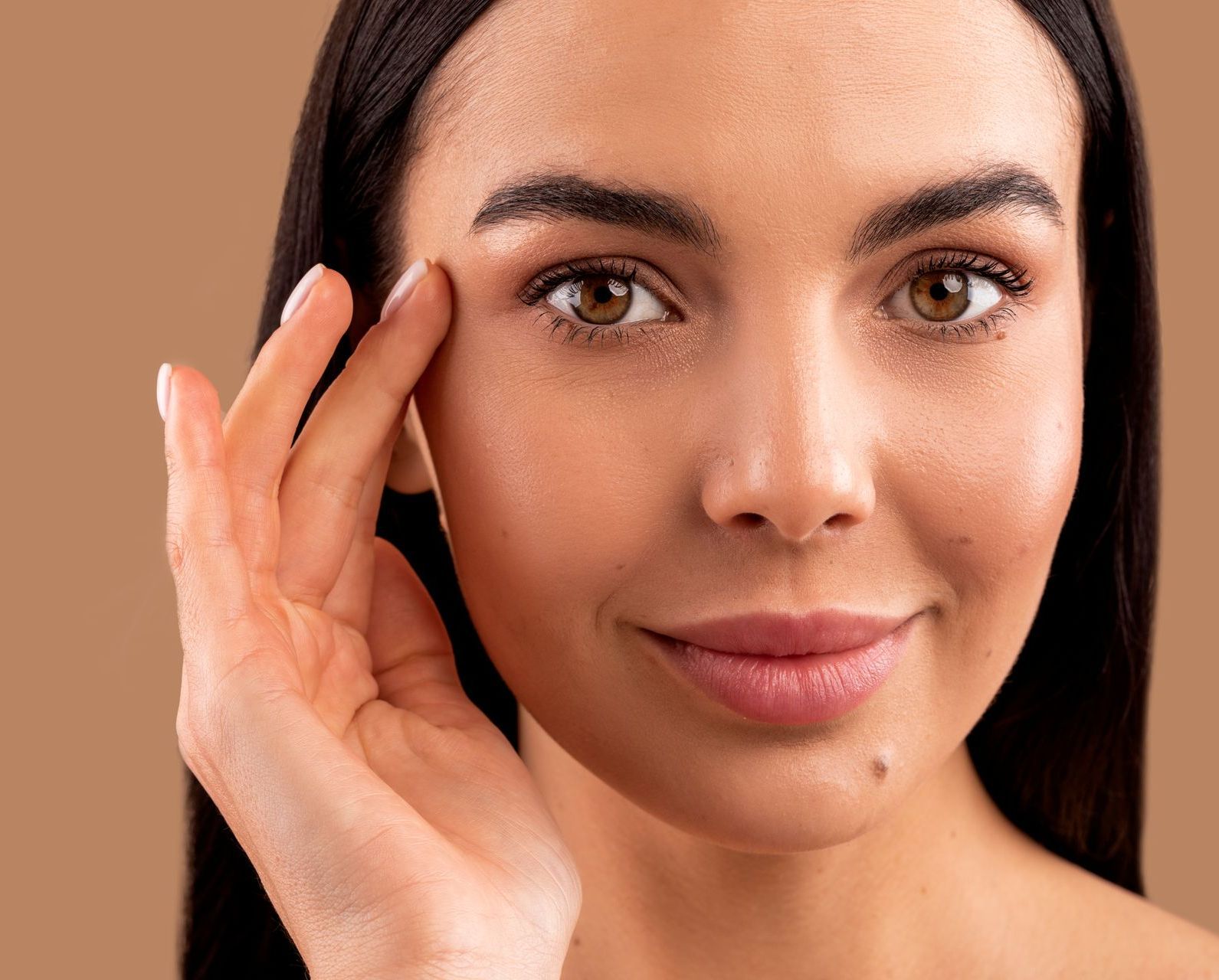 pretty young woman touching face