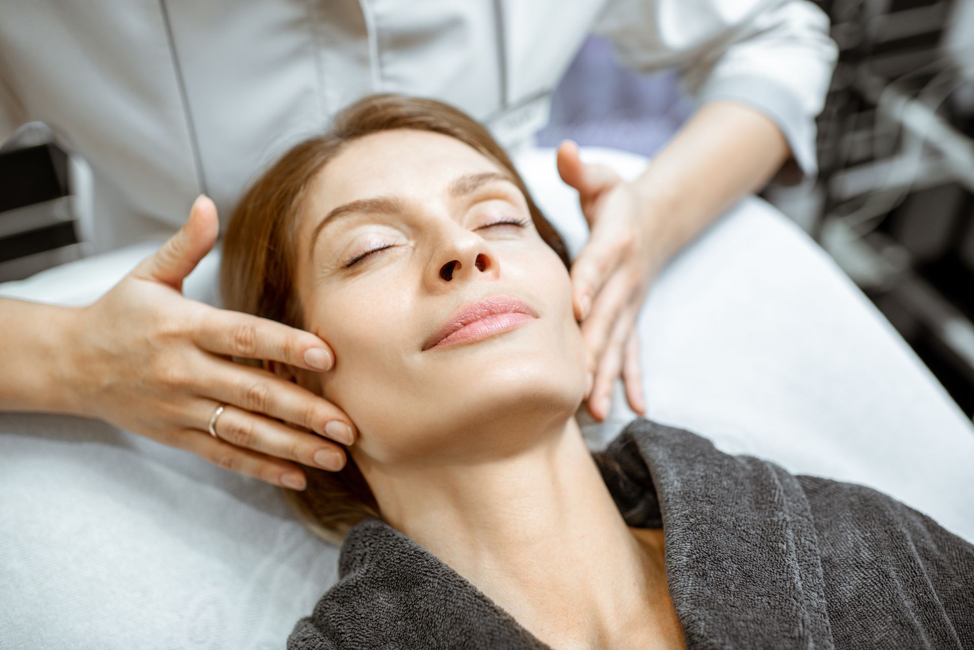 woman getting facial at spa