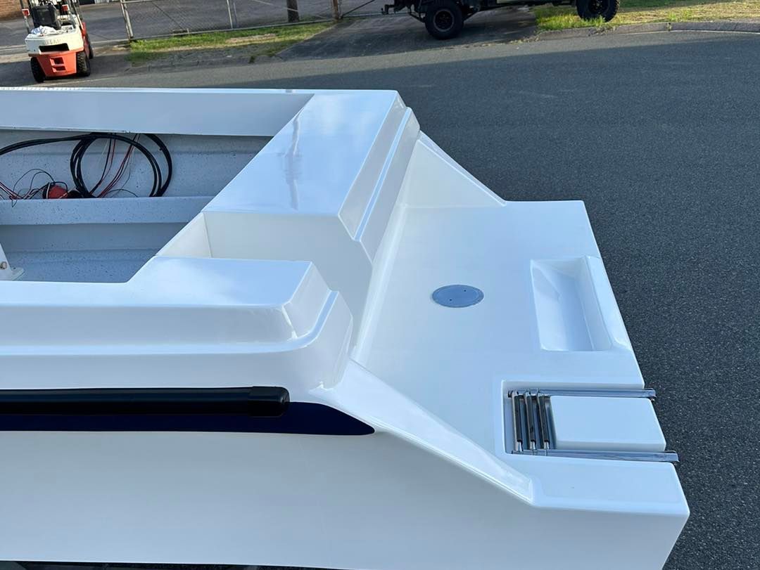 A White Boat Is Parked On The Side Of The Road — Murraycraft Fibreglass In Glenella, QLD