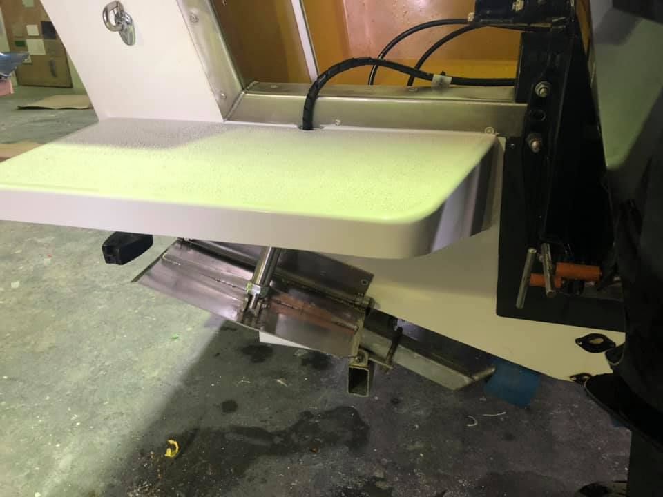 A Machine Is Sitting On A Concrete Floor With A Cutting Board On Top Of It — Murraycraft Fibreglass In Glenella, QLD