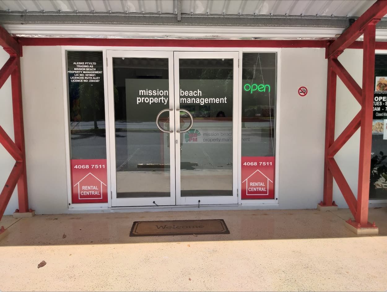 A Building with A Sign — Mission Beach Property Management in Wongaling Beach, QLD