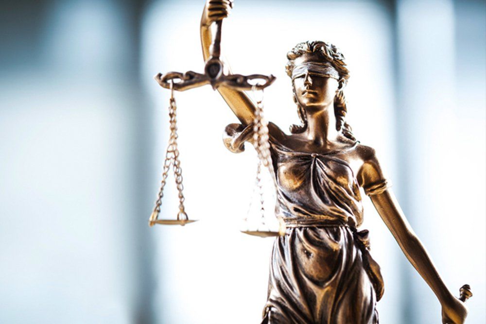 Statue of Justice | Laramie, WY | Brown & Hiser LLC