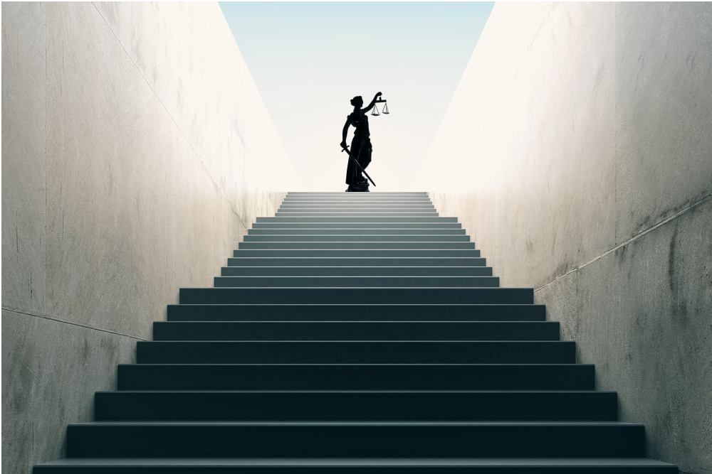 Silhouette standing at the top of a long staircase between tall white walls