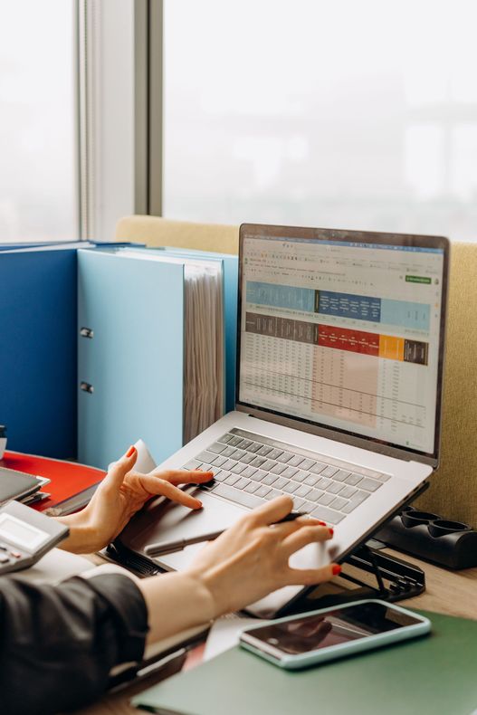A clean digital workflow diagram shown on a monitor on a tidy desk