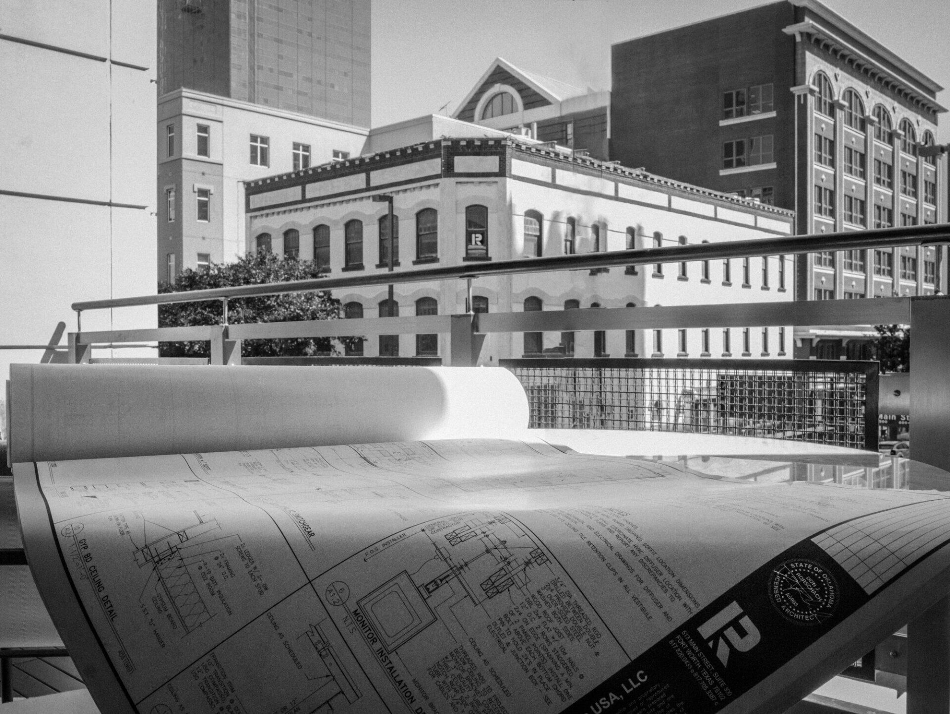 A black and white photo of a building with the letter r on it