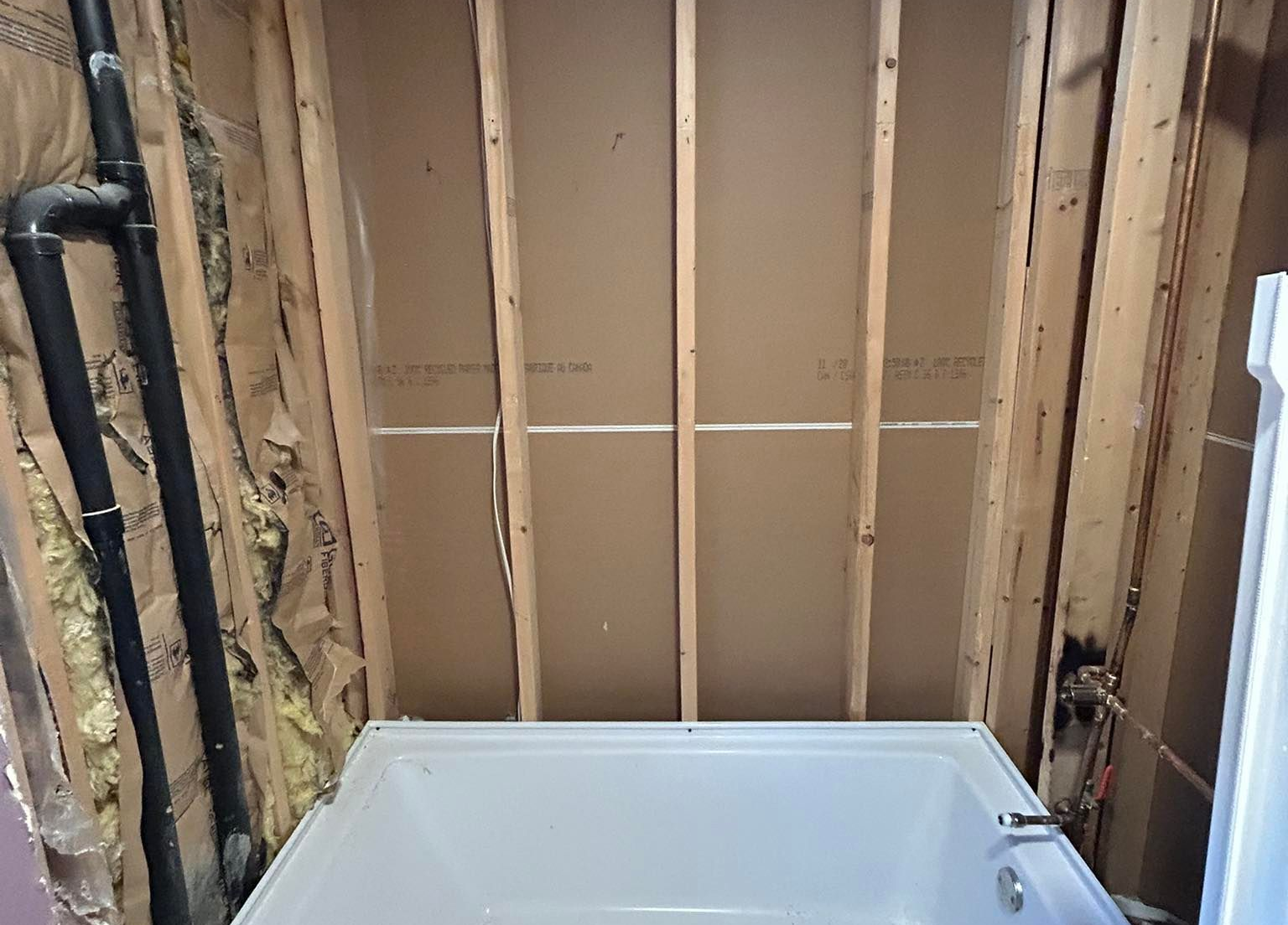 Modern bathroom with navy blue textured walls, white countertops, glass shower, and pebble floor. Modern bathroom with navy blue textured walls, white countertops, glass shower, and pebble floor.
