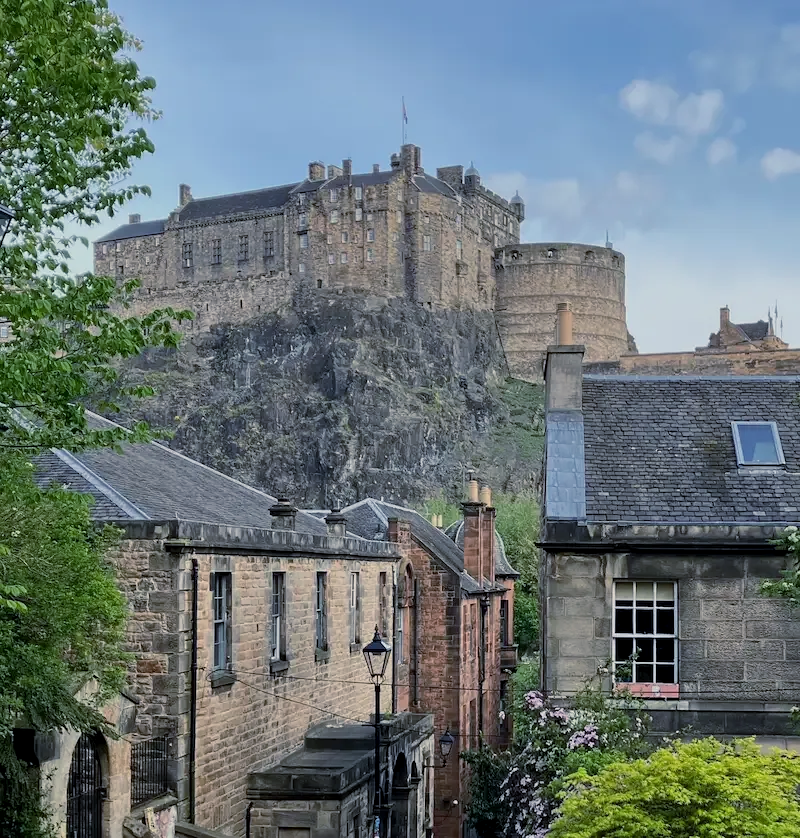 Scenic view of Dean Village stone houses and the Water of Leith during a private Edinburgh walking tour.