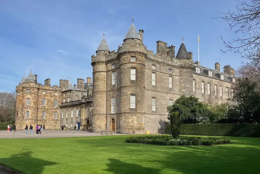 Tour guide Lewis leading a private walking tour past the Palace of Holyroodhouse.