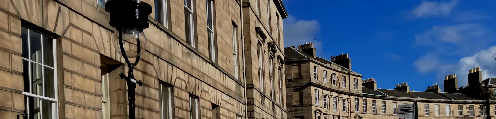 Picturesque view of New Town stone houses during an expert led Edinburgh walking tour.