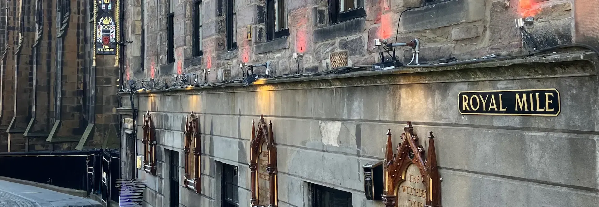 Picturesque view of Royal Mile stone houses during a corporate Edinburgh walking tour.