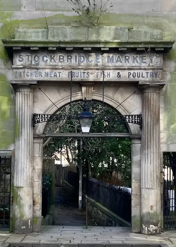 Scenic view of Stockbridge Market entrance from a corporate private walking tour around Edinburgh.