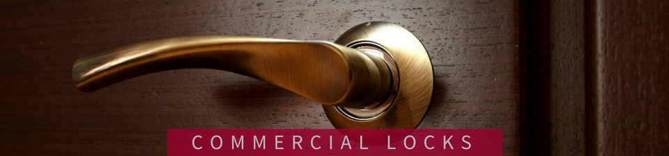 A brass-colored door handle mounted on a dark wooden door, with the text