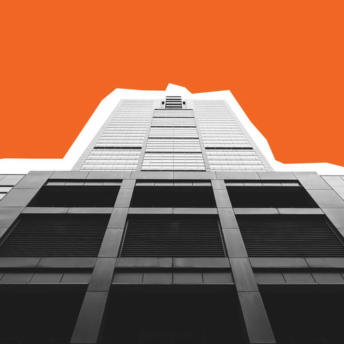 Low-angle view of a skyscraper against an orange sky. The building is monochrome with white outlines.