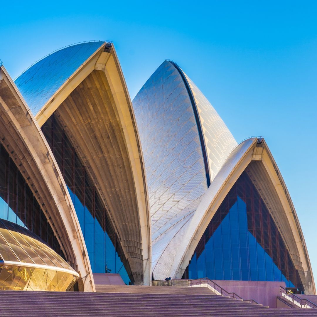 Sydney Opera House sails against a bright blue sky