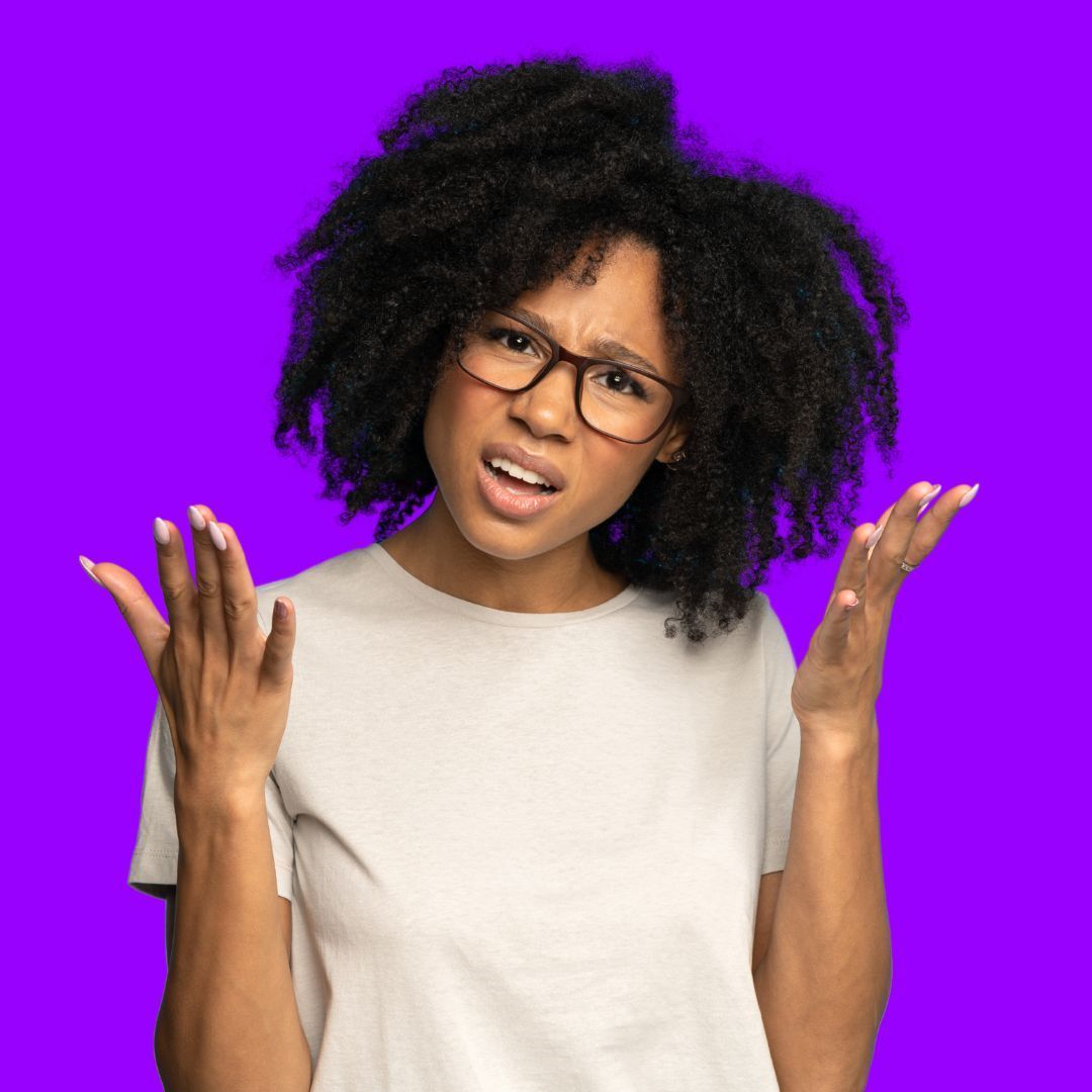 Confused person with hands raised against a purple background