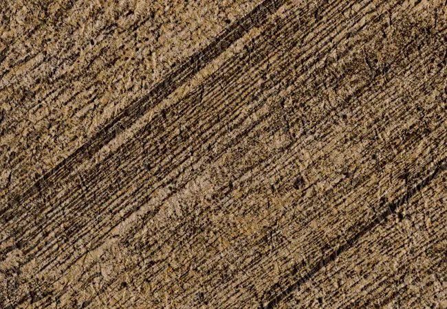 Un gros plan d'une de membrane de PVC couleur planche brune rustique