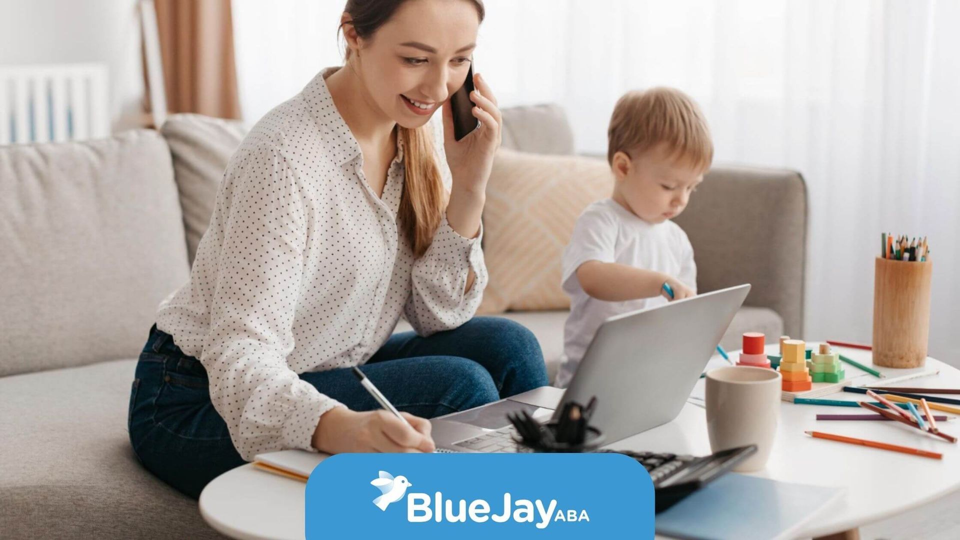Parent consulting a BCBA while supporting an autistic child.