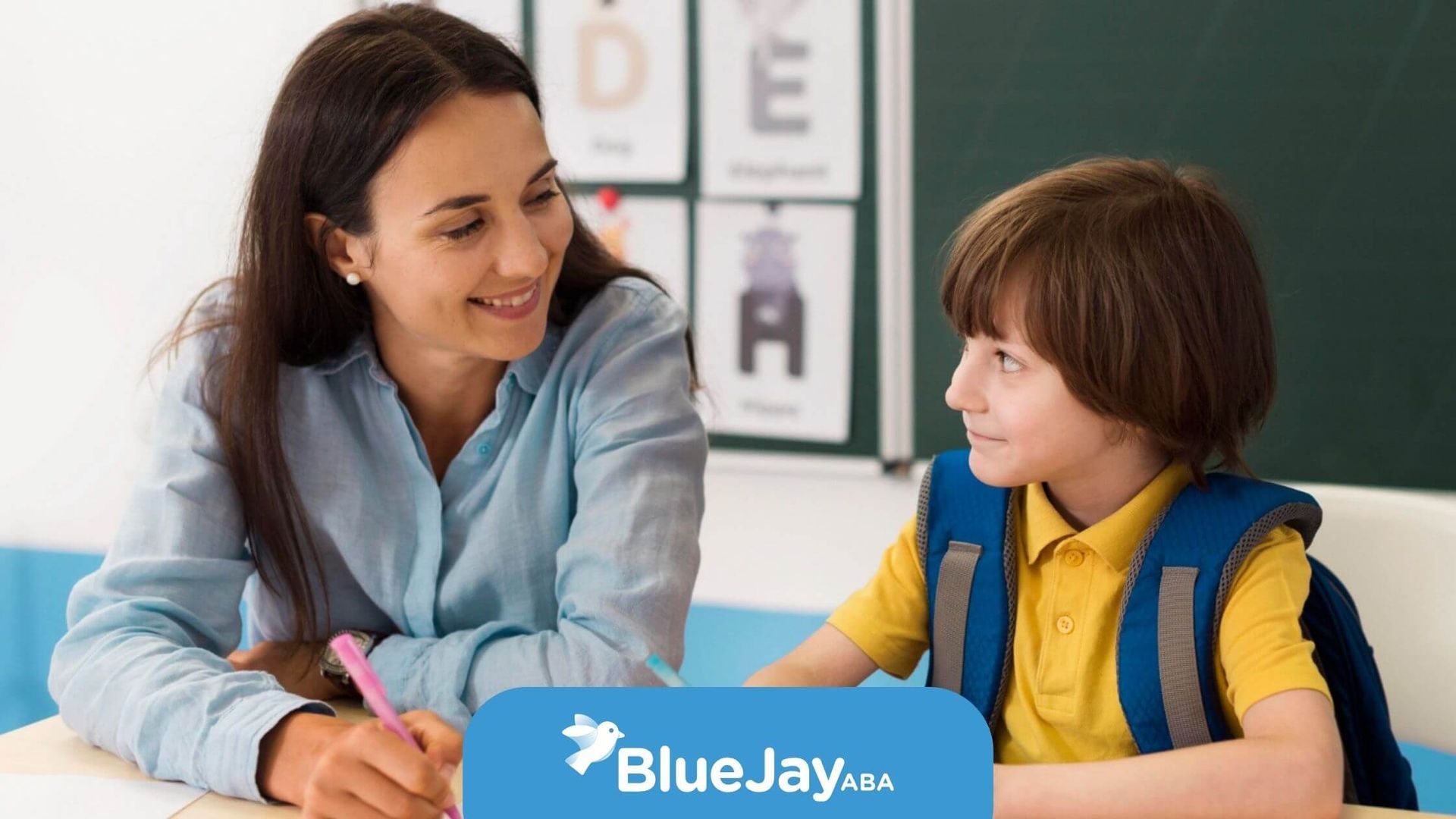 BCBA working one-on-one with a child in an ABA therapy center.