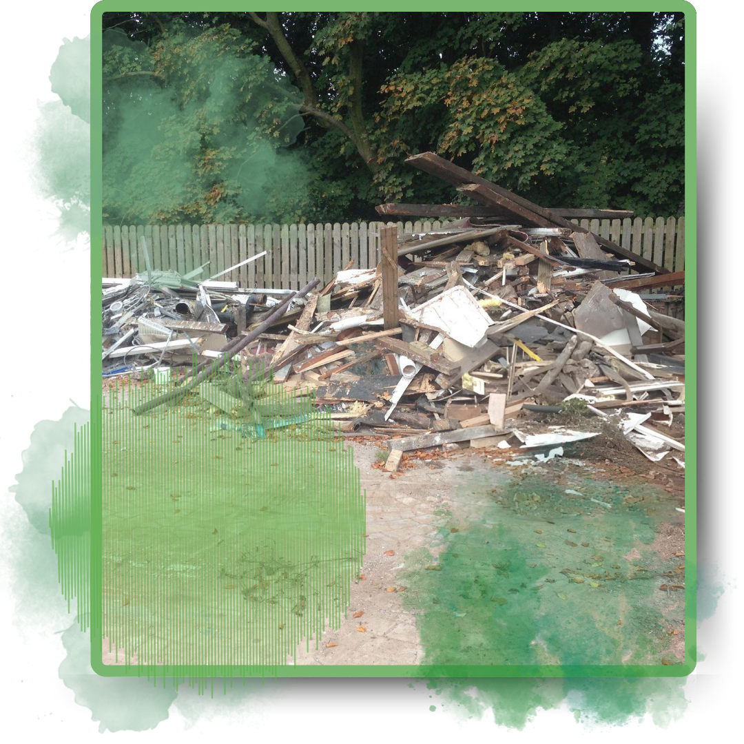 Assorted discarded construction wastes in the backyard.