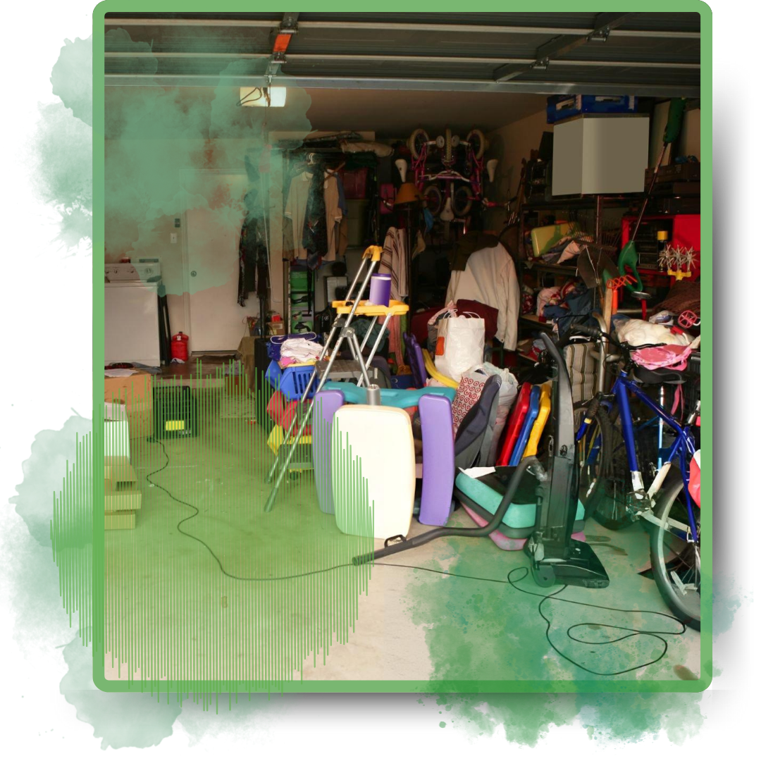Assorted discarded garbage inside a garage.