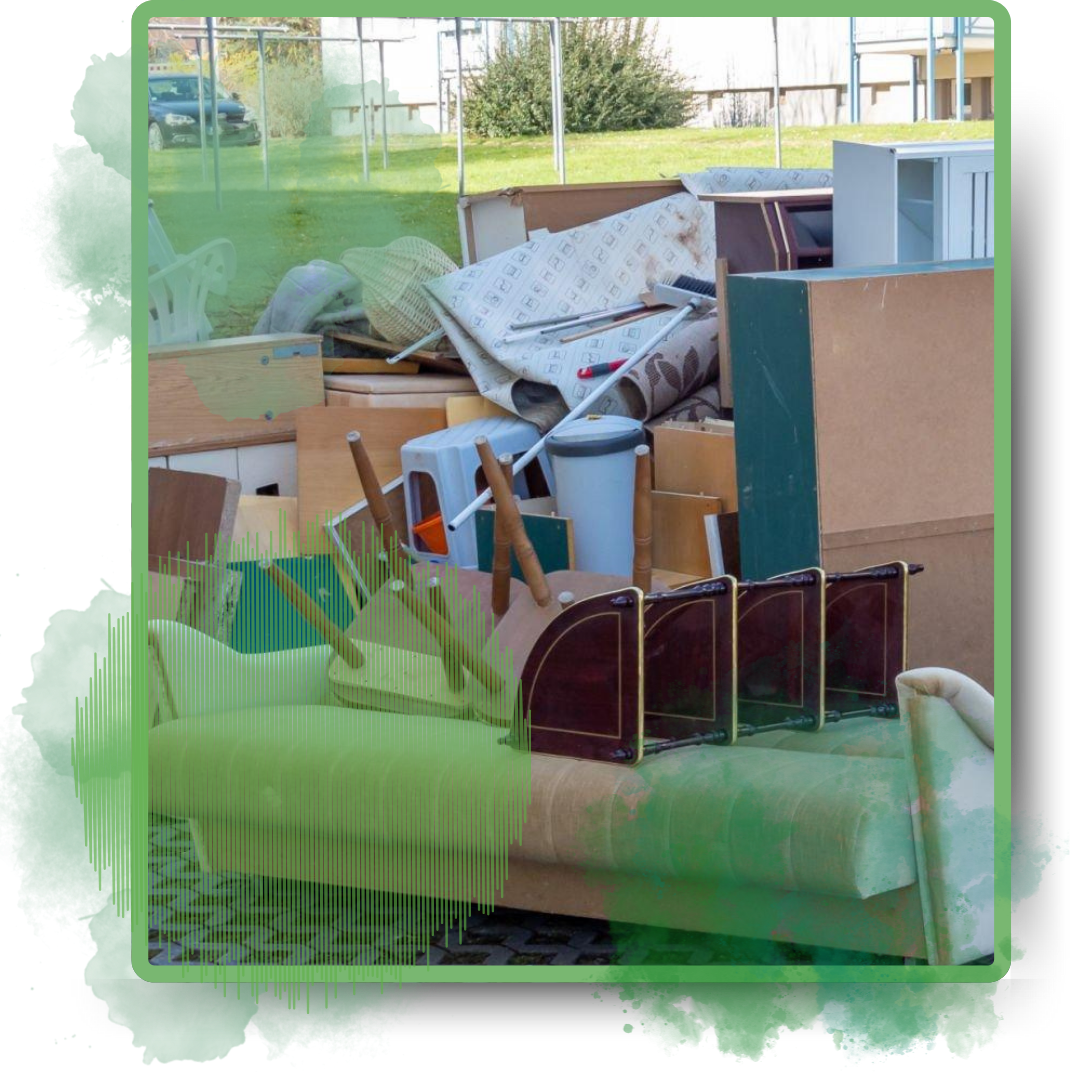 Assorted discarded furniture placed on the street as garbage.