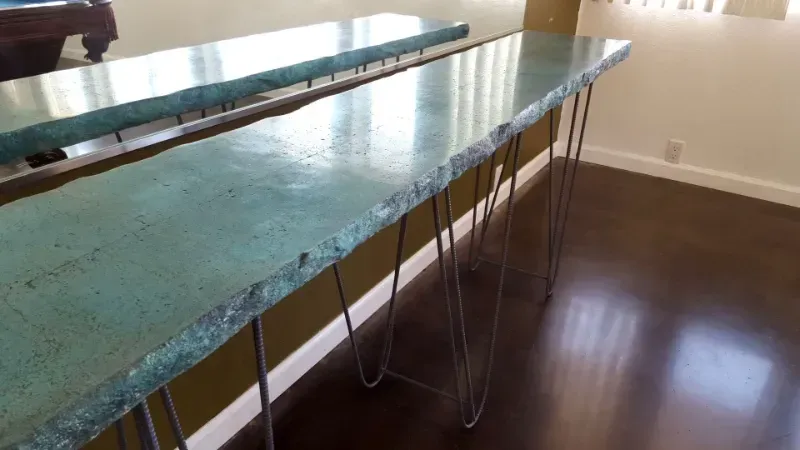 A long table with hairpin legs in a living room