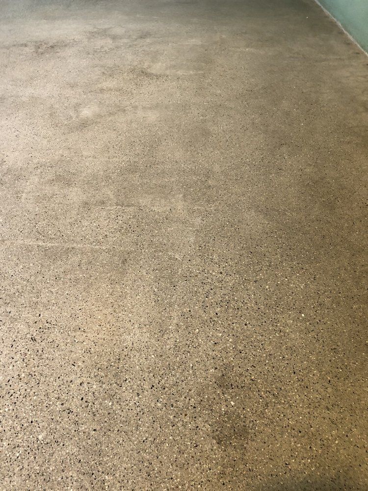 A close-up of a polished concrete floor in a room.