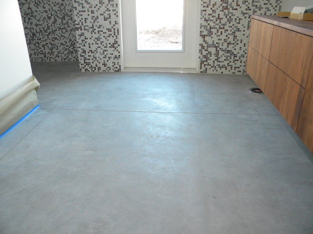 A room with a polished concrete floor.