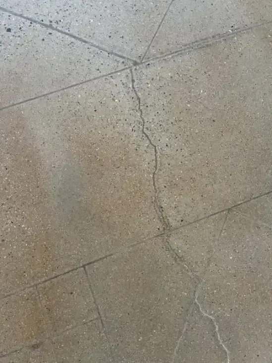 Cracked concrete tiles on a floor that has been restored in Rancho Mirage CA.