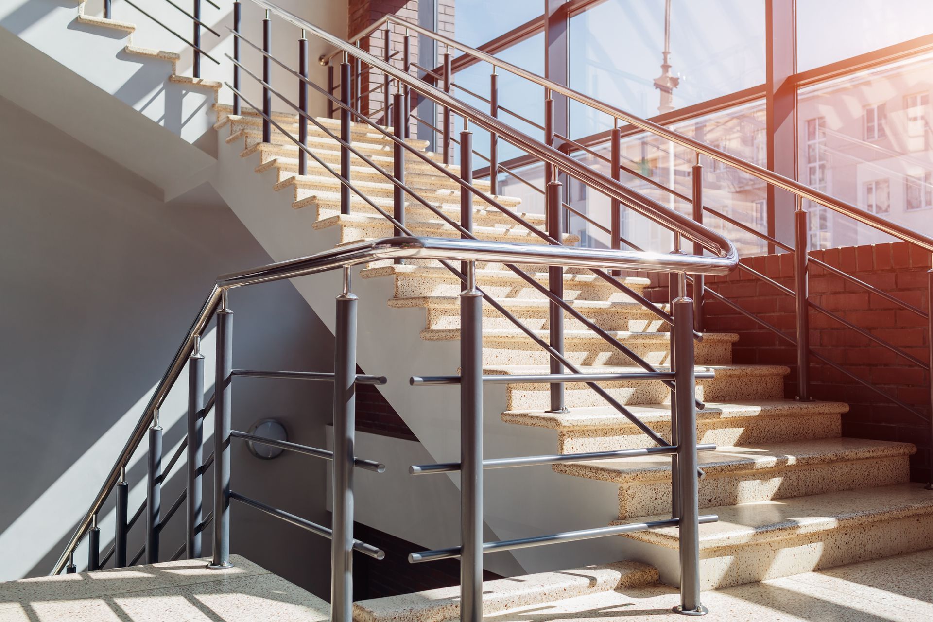 Steel Fabrication in Cincinnati, OH: Modern staircase with sturdy handrails in a contemporary