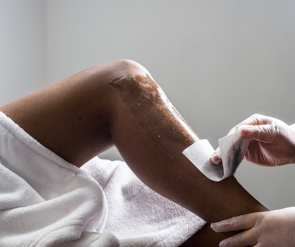 Waxing: A leg being waxed