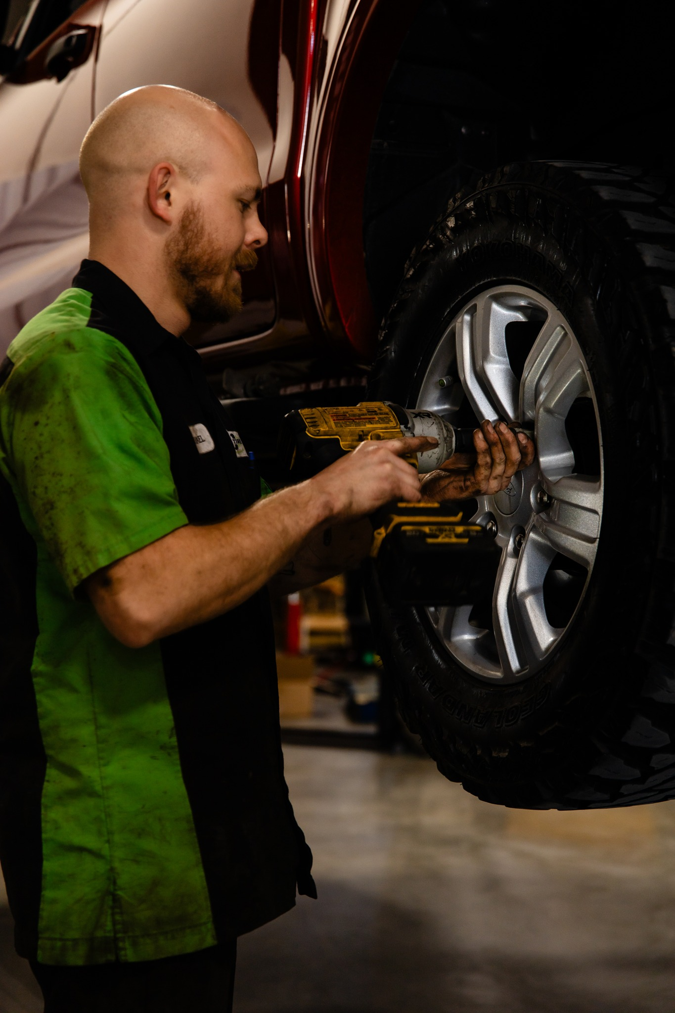 Mechanic working on a car tire | Pro Tire & Automotive Center