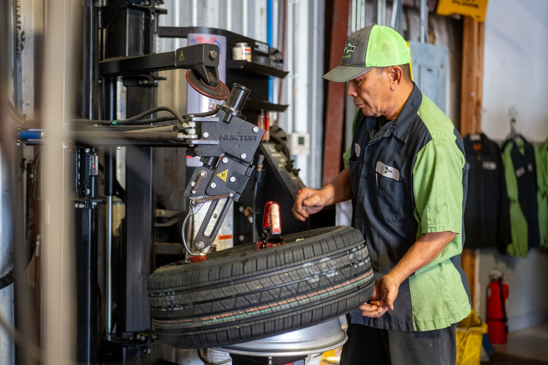 Mechanic working on a car tire | Pro Tire & Automotive Center