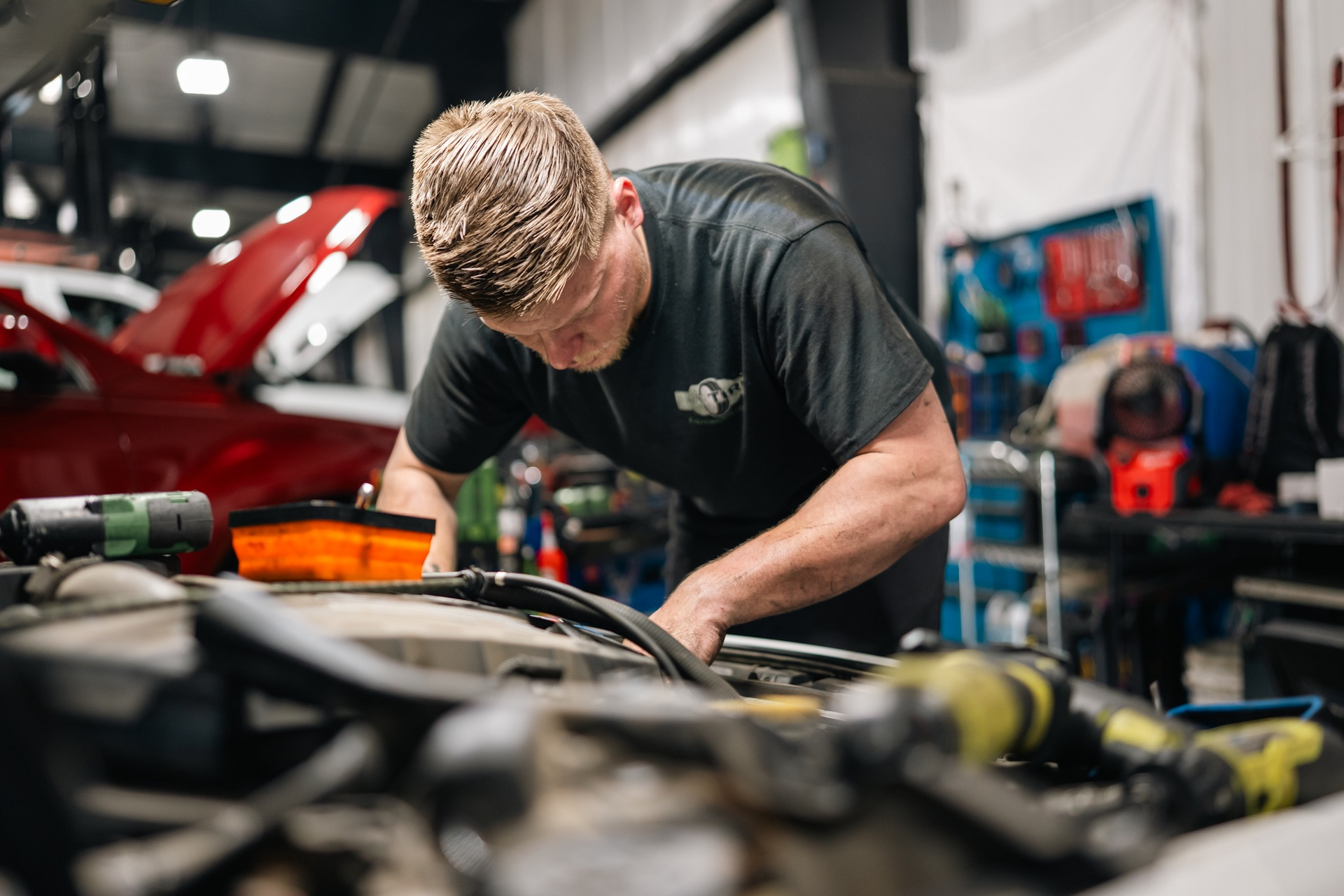 Mechanic working on a car engine | Pro Tire & Automotive Center