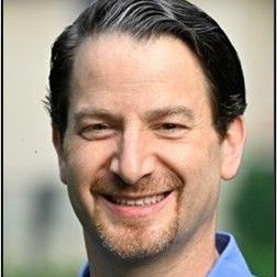 Greg Rosenbaum smiling for the camera.