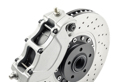 Silver car brake caliper and ventilated disc rotor on white background | Trask Automotive