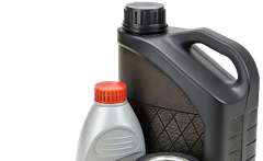 Black and silver motor oil jugs with red and black caps, shown close up | Trask Automotive