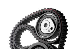 Black timing belt looped around two metal pulleys and gears on a white background | Trask Automotive