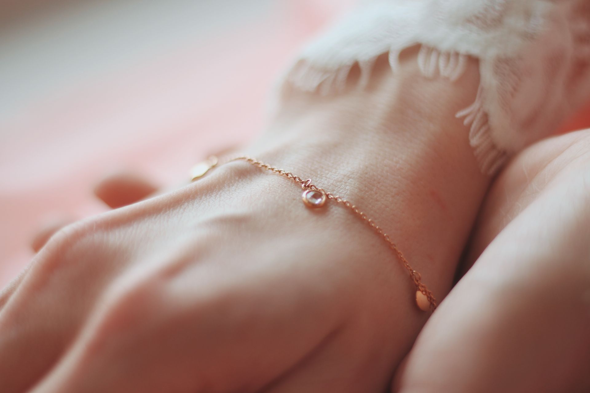 A close up of a woman 's hand with rings on her fingers.