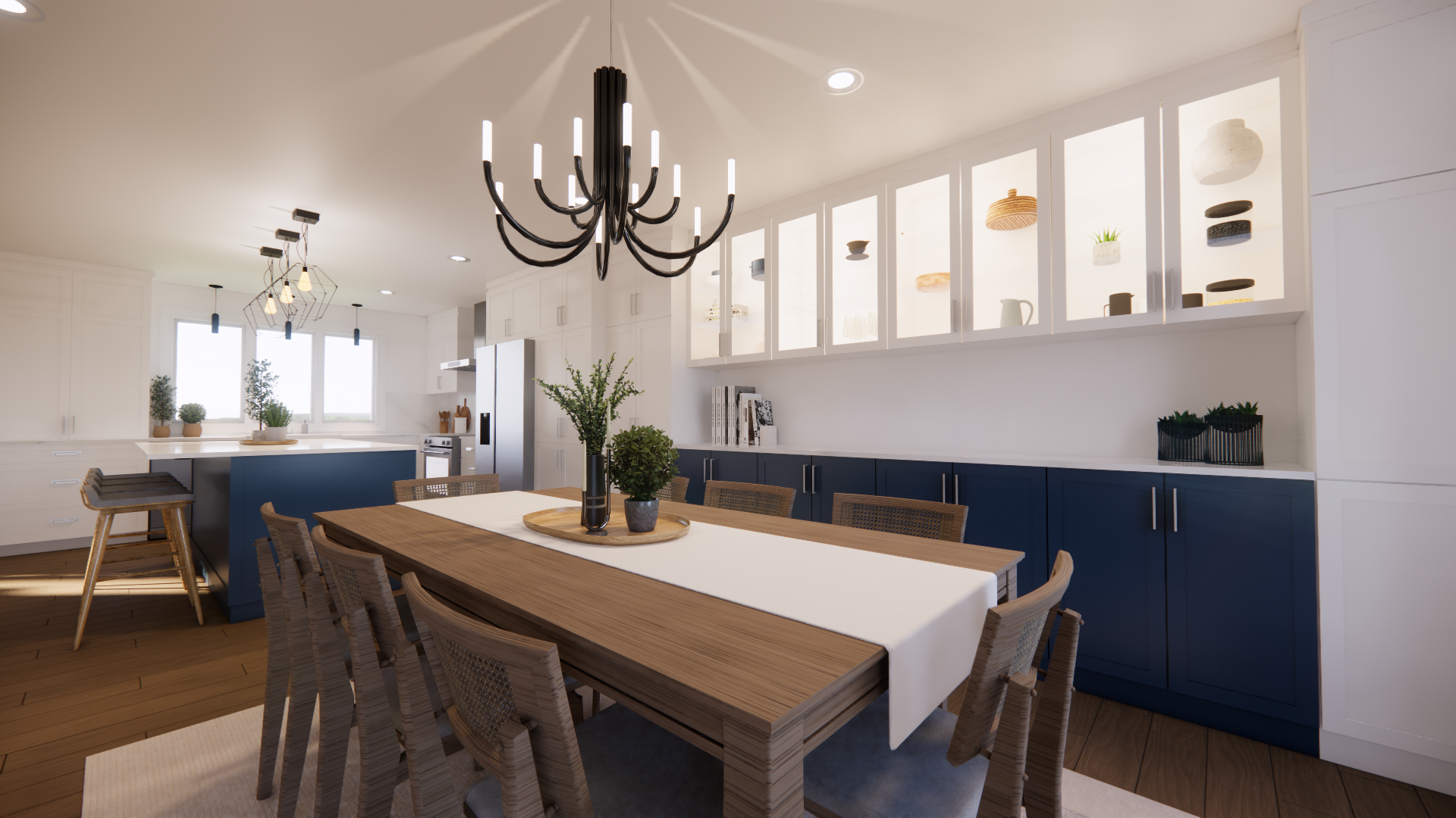 Salle à manger avec une longue table en bois, des placards bleus et un lustre noir.