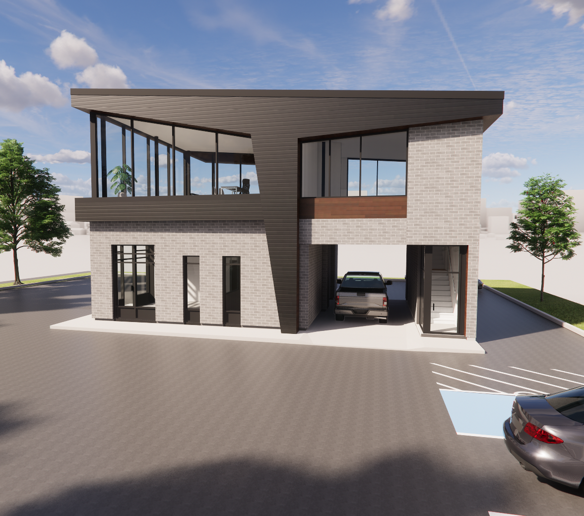 Bâtiment moderne de deux étages avec un parking souterrain. Fenêtres en verre, briques grises et touches sombres. Extérieur ensoleillé.