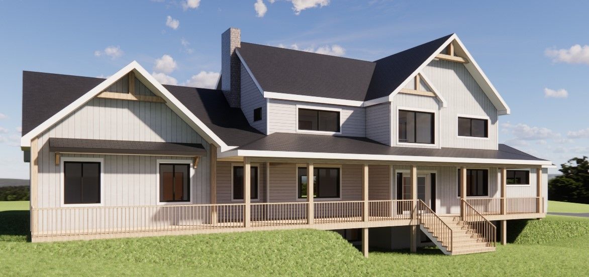 Une maison à deux étages avec une véranda qui l'entoure, un bardage gris et un toit noir, située sur une colline herbeuse.