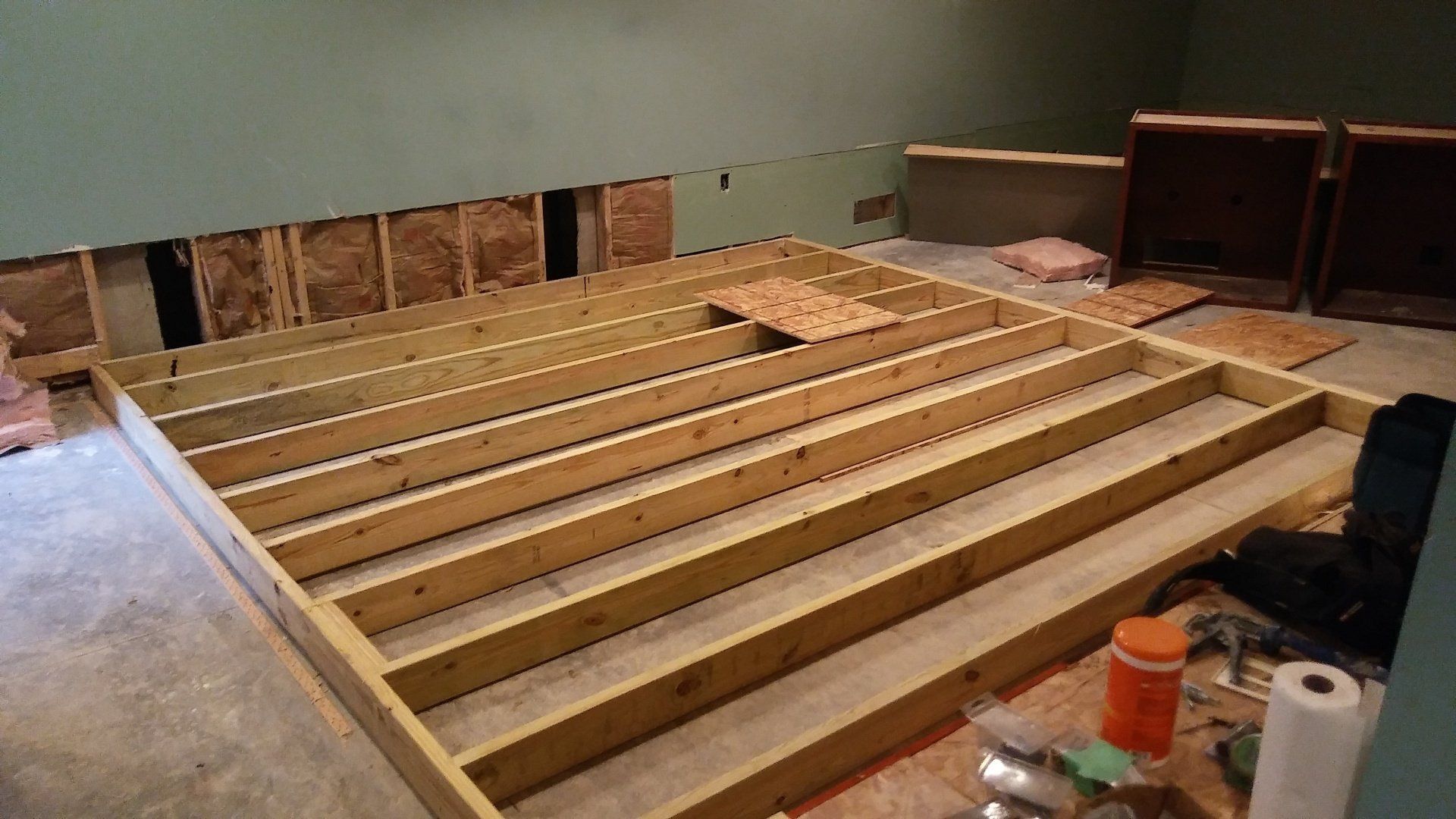 A wooden floor is being built in a room.