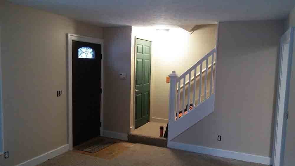 There is a staircase leading up to the second floor of a house.
