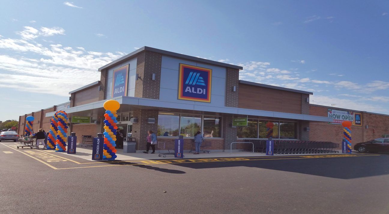Exterior of a Lidl supermarket with blue and red signage on a sunny day