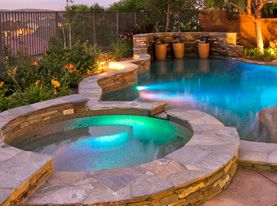 A swimming pool with a cover on it and a fence in the background.