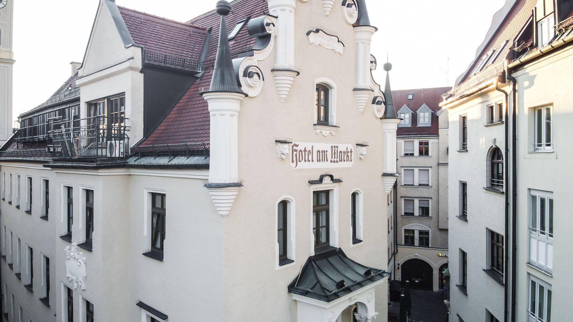 Cream-colored building with decorative spires,
