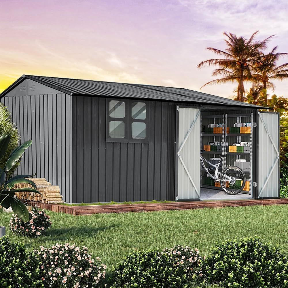 A dark grey metal storage shed with open double doors revealing shelves and a bicycle, set in a sunny, grassy backyard.