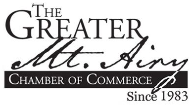 Logo for The Greater Mt. Airy Chamber of Commerce, with “Since 1983” text
